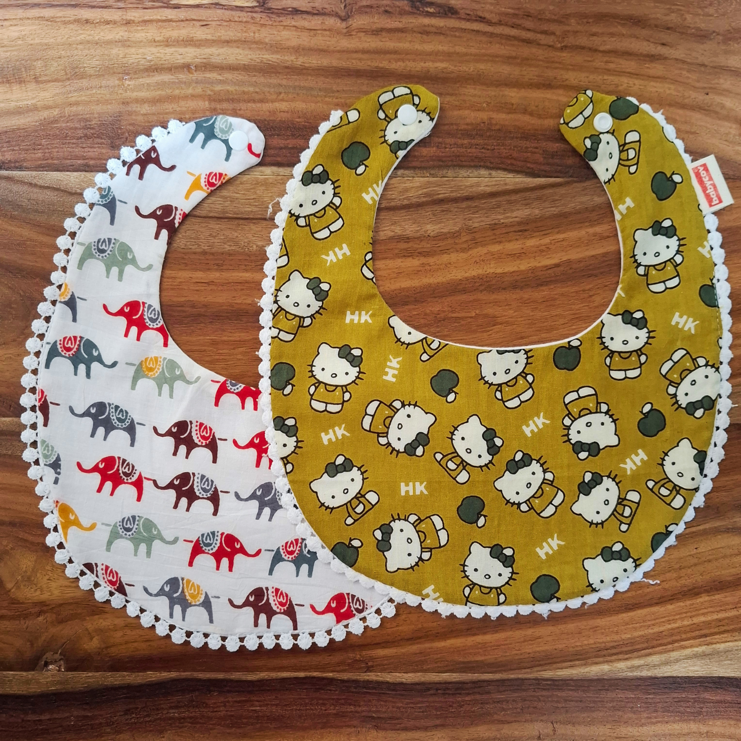 pack of 2 bibs multi color & design